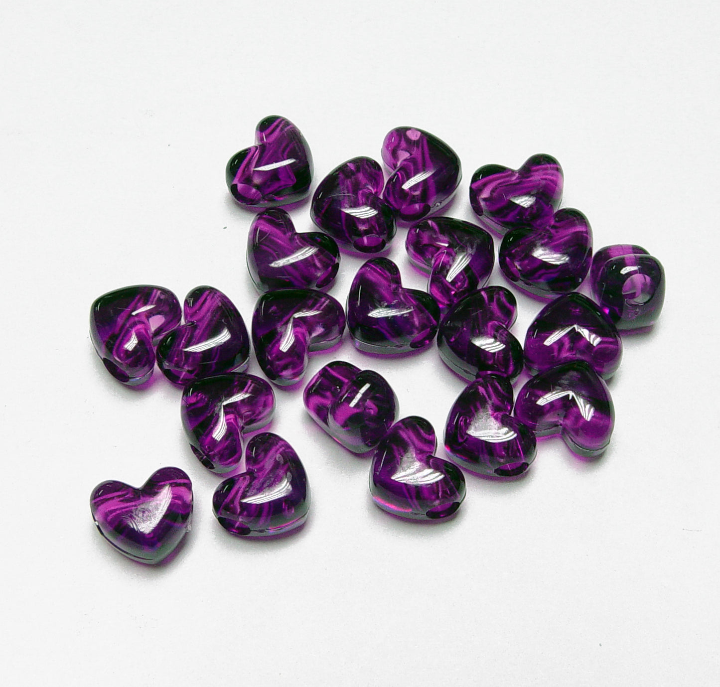 
                  
                    Transparent Dark Amethyst Heart shaped Pony Beads
                  
                